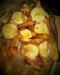 A poutine recipe with potatoes and gravy.