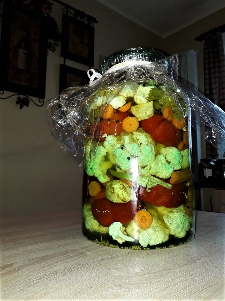 A cauliflower recipe in a plastic bag on a table.